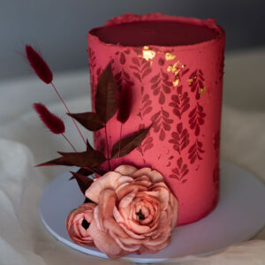 red birthday cake with gold Gleneagles
