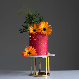 red birthday cake with orange flowers auchterarder