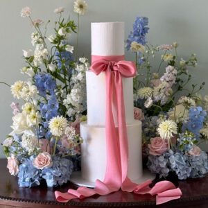 white birthday cake with pink ribbon perthshire